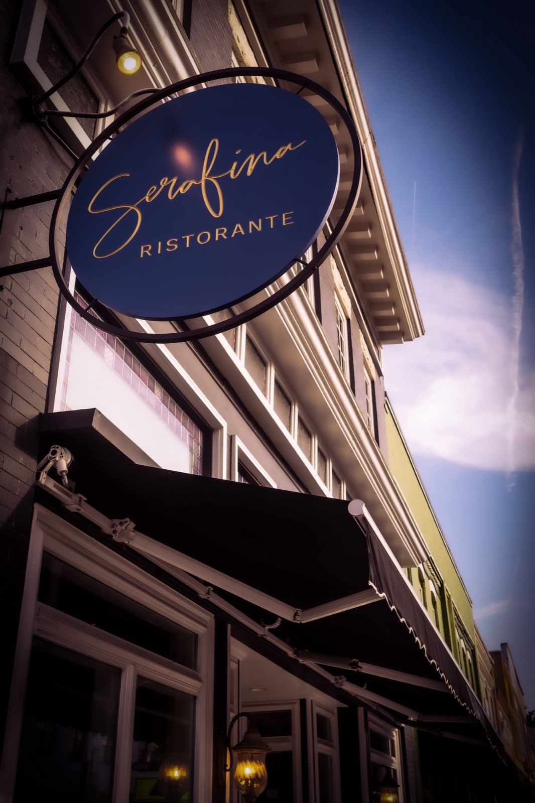 The Serafina Ristorante sign hanging outside the restaurant in downtown Apex, North Carolina